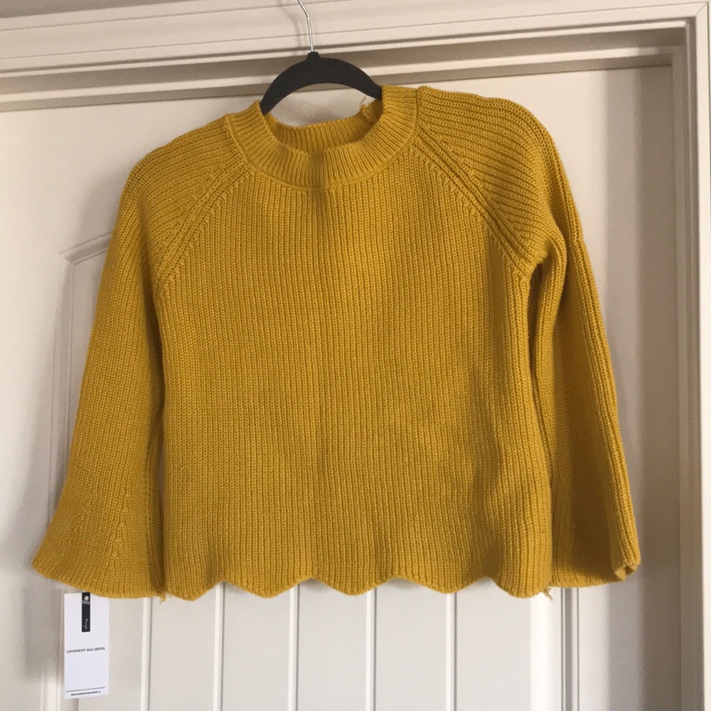 Crop sweater with bell sleeves.